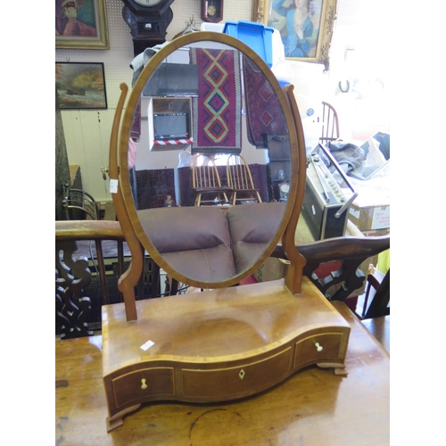 562 - A Nineteenth Century Mahogany and Boxwood Strung Swivel Toilet Mirror