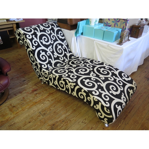 567 - A Contemporary Chaise Longue with stylised foliate scroll black and white upholstery