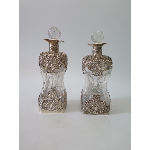 9b - A Pair of Victorian Decanters of Waisted Form with silver mounts, London 1896, W.C