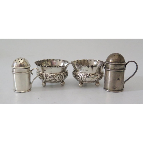 13 - A Pair of Edward VII Silver Embossed Salts, Birmingham 1983 and two silver treasure style pepper pot... 