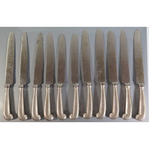 14 - Set of 11 Georgian silver pistol handled knives with crests