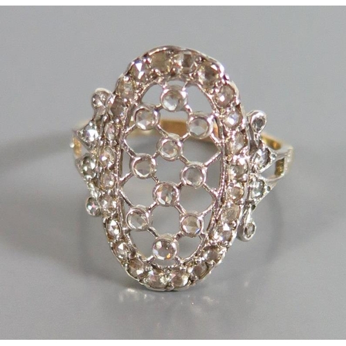 156 - A Diamond Dress Ring in a precious yellow and white metal setting, size M.5, 2.9g