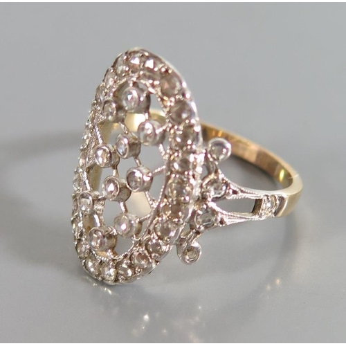 156 - A Diamond Dress Ring in a precious yellow and white metal setting, size M.5, 2.9g