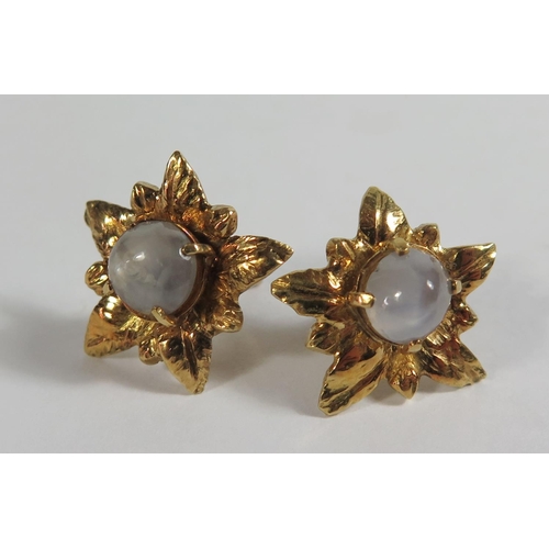 168 - A Pair of Star Sapphire Earrings in a high carat gold setting, 7g