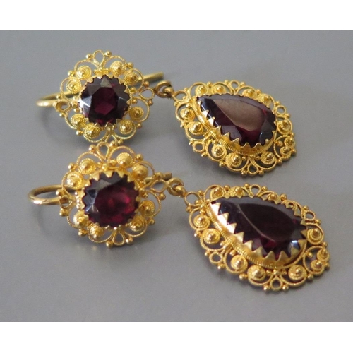 170 - A Pair of Garnet Pendant Earrings in precious yellow filigree metal setting, c. 48mm drop, 7.7g