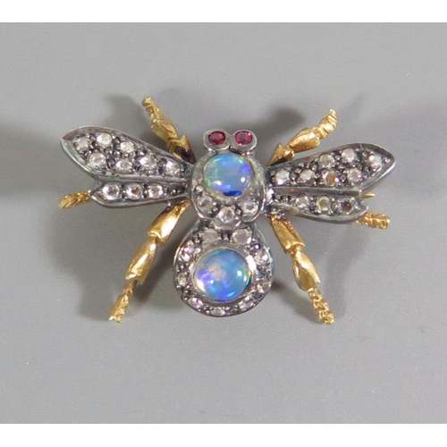 175 - A White Opal, Ruby and Diamond Set Insect Brooch in a high carat precious yellow metal setting, c. 2... 