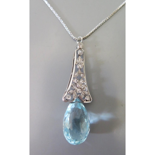 178 - An Aqua Marine and Diamond Pendant in a precious white metal setting and on .585 white gold chain (A... 