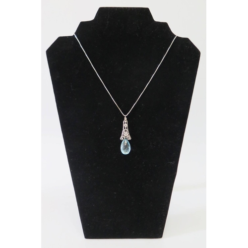 178 - An Aqua Marine and Diamond Pendant in a precious white metal setting and on .585 white gold chain (A... 