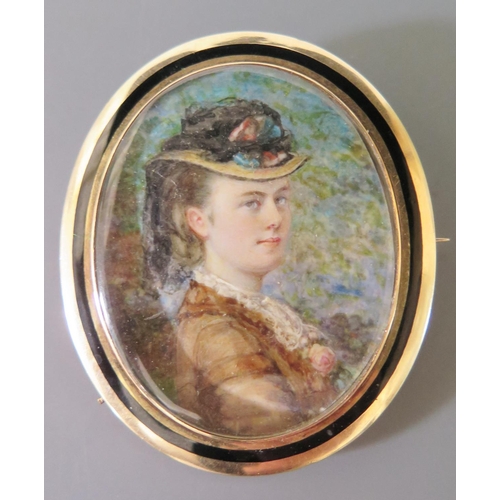 191 - A Victorian Half Length Portrait Miniature of a lady with hat and in a gold and enamelled brooch set... 