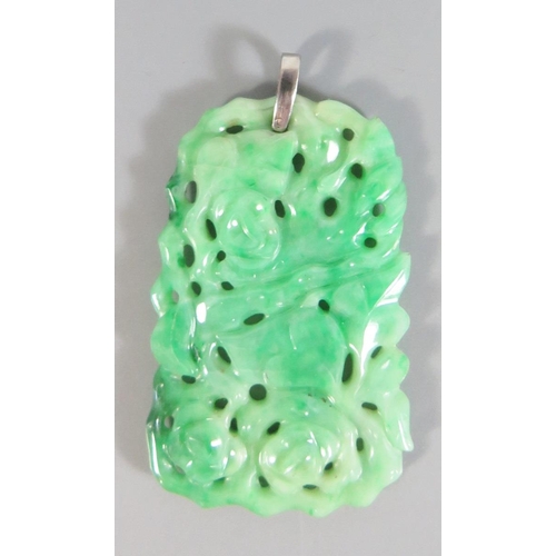 196 - A Chinese Carved and Pierced Jadeite Pendant decorated with pheasant and foliage on a diamond and pr... 