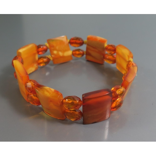 211 - A Graduated Square Amber Bead Necklace and Bracelets, largest square bead c. 10mm, 71.8g