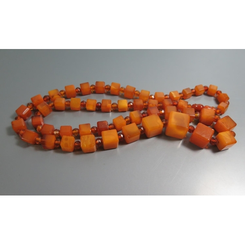 211 - A Graduated Square Amber Bead Necklace and Bracelets, largest square bead c. 10mm, 71.8g