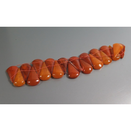 211 - A Graduated Square Amber Bead Necklace and Bracelets, largest square bead c. 10mm, 71.8g