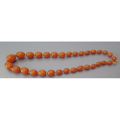 212 - A Graduated Amber Bead Necklace, largest bead c. 25 x 20mm, 51.4g (pos. pressed resin)