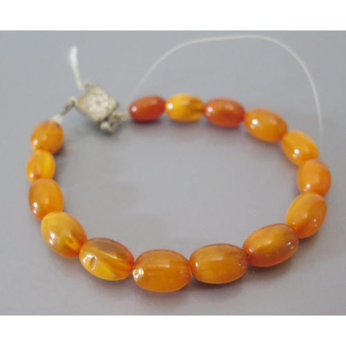 215a - A Butterscotch Amber Bead Necklace 42.9g (largest bead c. 22 x 16mm) AND bracelet 7.5g