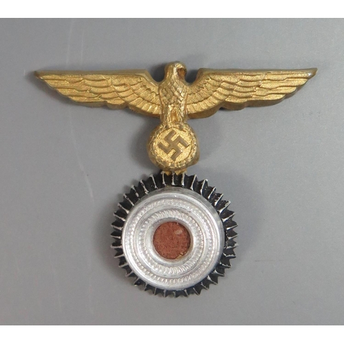 260 - A German WWII Kriegsmarine Cap Eagle (top pin missing)