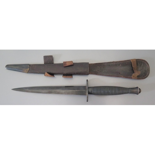 279a - An Early Fairbairn-Sykes Fighting Knife with leather scabbard, 29.5cm