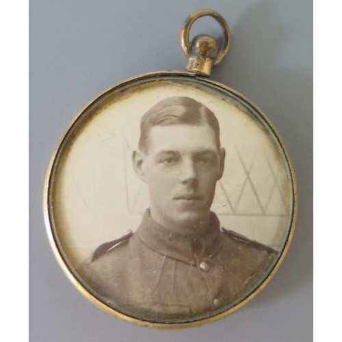 281 - A Double Sided Photograph Pendant showing portraits of Royal Flying Corps Soldier (pre-1 April 1918)