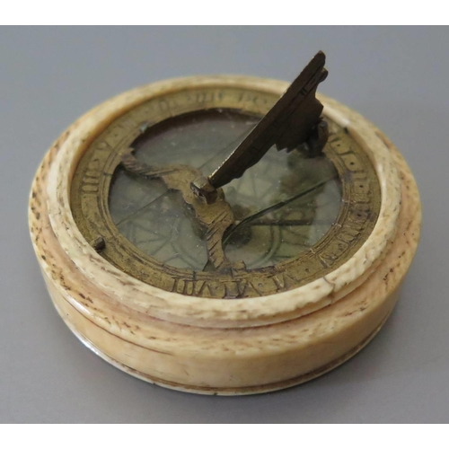 290 - An Early Ivory Cased Pocket Compass Sundial, 4cm diam. (glass cracked, compass not working and screw... 