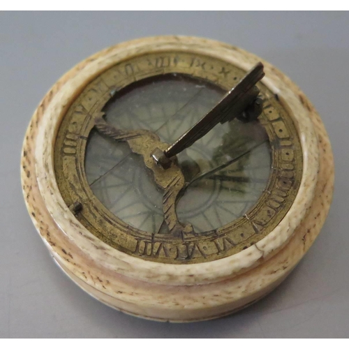 290 - An Early Ivory Cased Pocket Compass Sundial, 4cm diam. (glass cracked, compass not working and screw... 