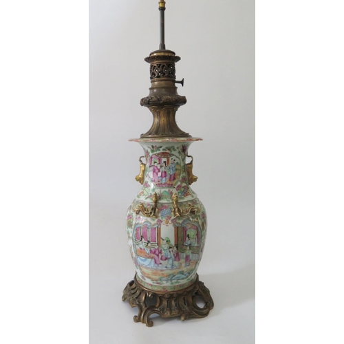 371 - A Nineteenth Century Cantonese Porcelain Famille Rose Vase with rococo ormoulu mounts, drilled to ba... 