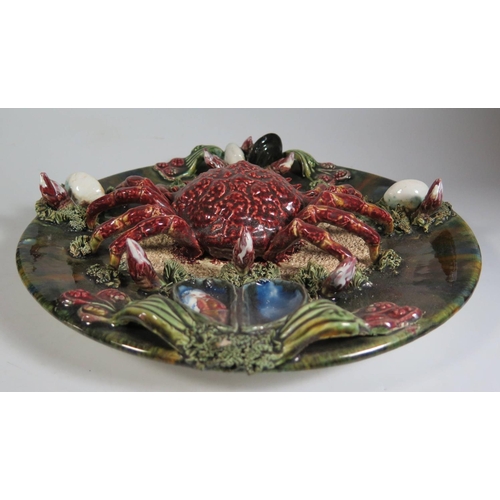 382 - A Palissy Ware Plate decorated with crab and other seafood, 32cm