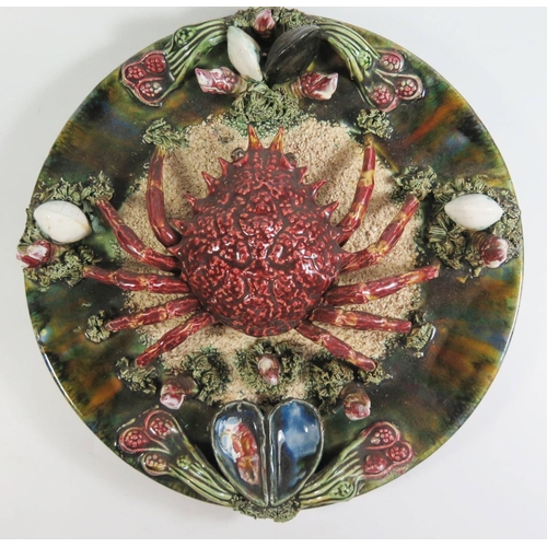 382 - A Palissy Ware Plate decorated with crab and other seafood, 32cm