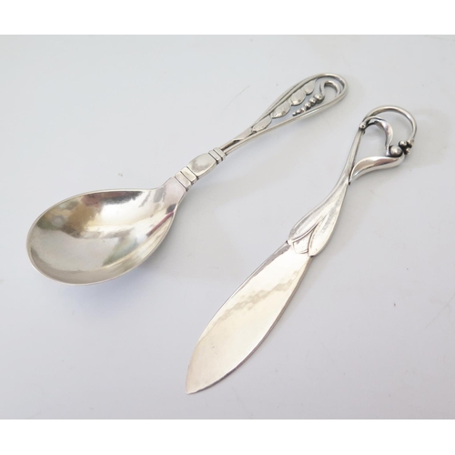 59 - A Georg Jensen Silver Butter Knife marked GI 122 London 1927 import marks 26g and spoon marked 42 35... 