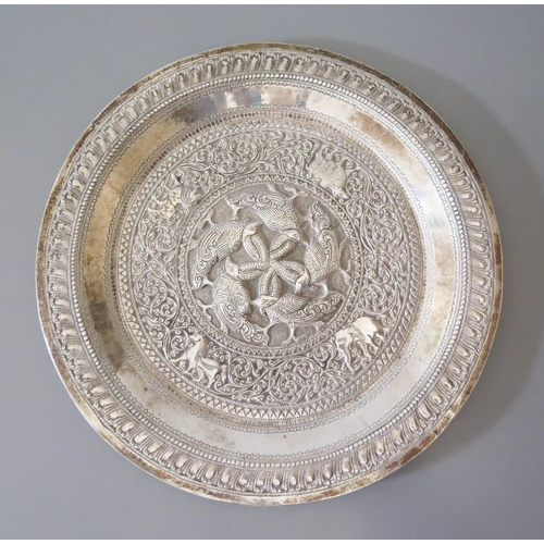 7 - An Indian Silver Plate with stylised foliate decoration and central reserve of geese with entwined n... 