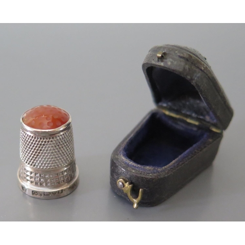 73 - An Edward VII Silver Thimble with agate top Chester 1907, Charles Horner and leather case