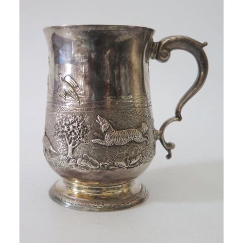 95 - A George III Silver Pint Mug with later decoration of spaniel chasing pheasants in a landscape, Lond... 