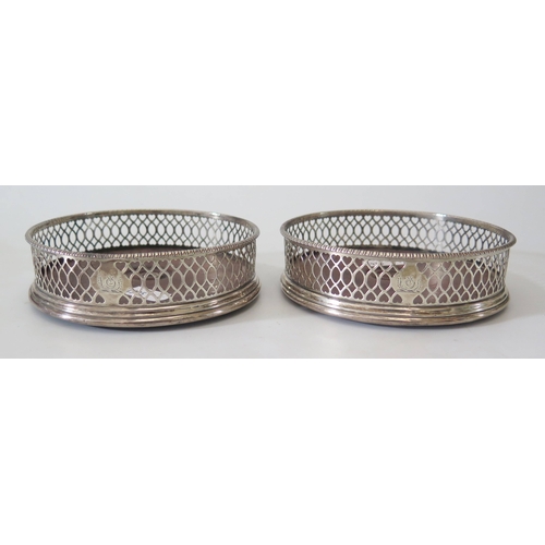 3 - A Pair of George III Silver Wine Coasters with pierced aprons and armorial of winged Crescent with s... 