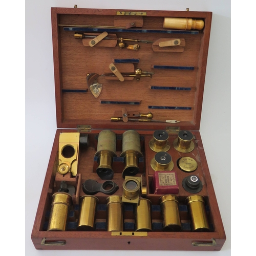 302e - A Cased Binocular Microscope by J. Swift of 15 Kingsland Road No. 1570 with fitted case of lenses
