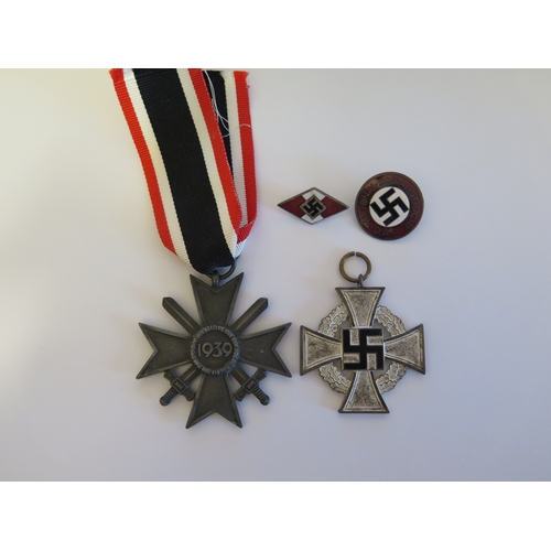 261 - A German WWII SS Cap Eagle, RZM M1/40 and Two German Third Reich Medals and two badges