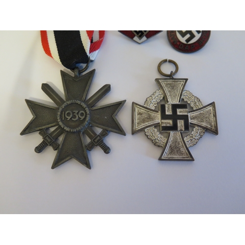 261 - A German WWII SS Cap Eagle, RZM M1/40 and Two German Third Reich Medals and two badges