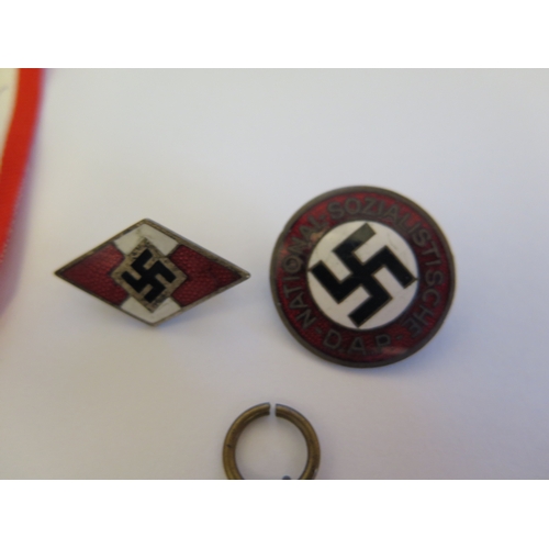 261 - A German WWII SS Cap Eagle, RZM M1/40 and Two German Third Reich Medals and two badges