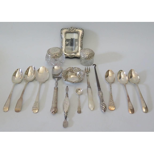 14 - A small silver photograph frame, two silver dressing table pots cutlery etc