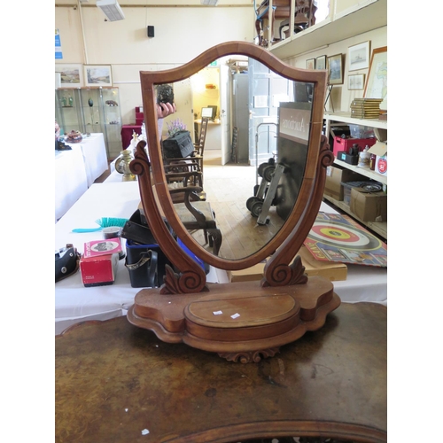 500 - A Victorian kidney shaped dressing table with heavily carved decoration and seaweed marquetry