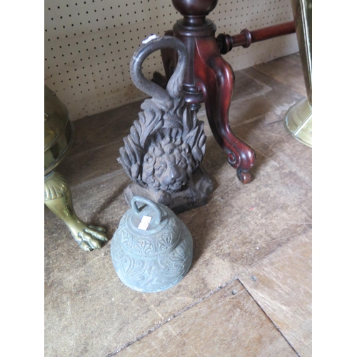 526 - A 19th Century cast iron lion mask door stop and Bell