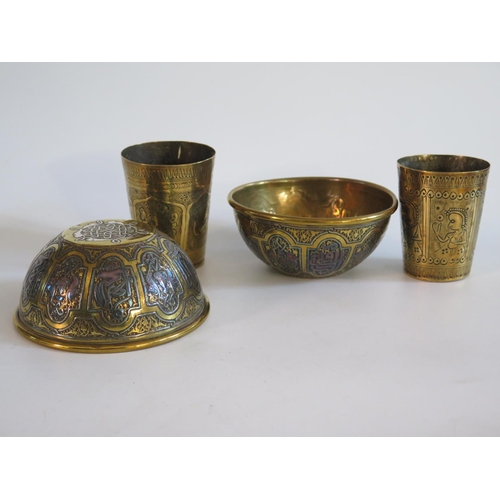 545 - A Pair of Islamic Brass and Silver Inlaid Bowls and two beakers