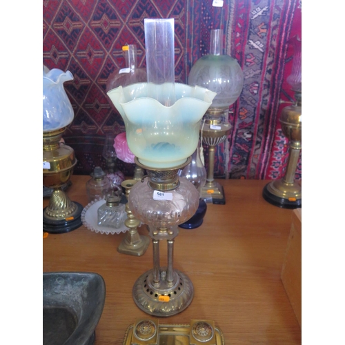 581 - A Victorian brass oil lamp with Vaseline glass shade