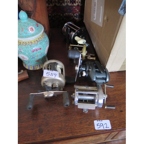 589 - A collection of fishing reels including The Spares, Shakespeare Triumph and 3 others