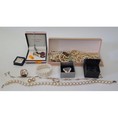 63 - A selection of costume jewellery including simulated pearls