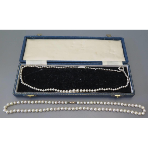 67 - A graduated cultured pearl necklace with nine carat gold clasp and one other