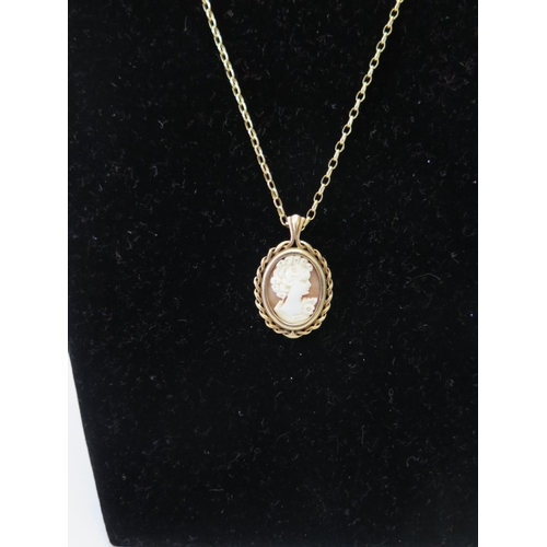 79 - A nine carat gold cameo pendant on nine carat gold chain and with matching ring, 7.1g