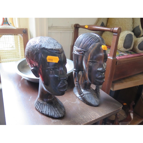 830 - Circular mirror, carved African busts and pewter dish