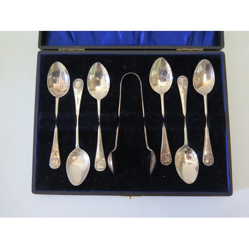 9 - A cased set of silver teaspoons and sugar tong