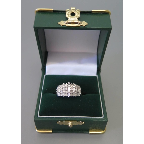 95 - An 18 carat yellow gold and diamond ring set with baguette and round cut Stones, size 0.5, 5.5g