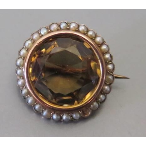 98 - A nine carat gold citrine and seed pearl brooch, 21mm diam., 5.7g, Birmingham 1906