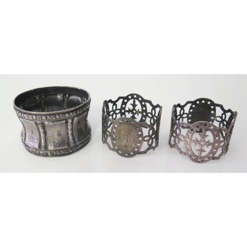 24 - A Pair of Victorian Pierced Silver Napkin Rings London 1892, George Fricker and French silver napkin... 
